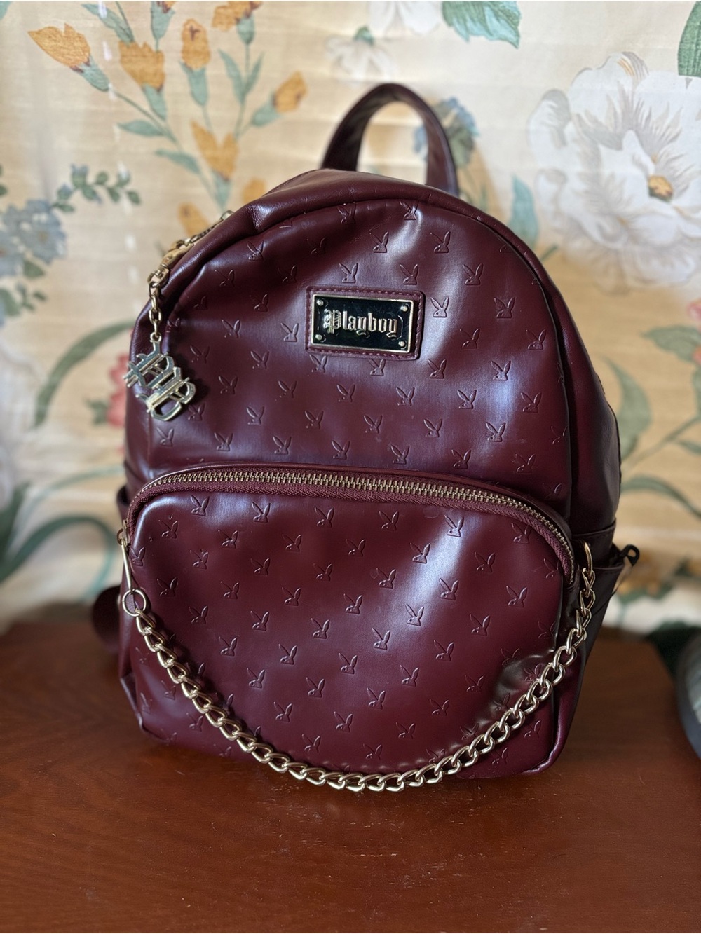 PLAYBOY Burgundy Mini Backpack with Gold Chain Accents